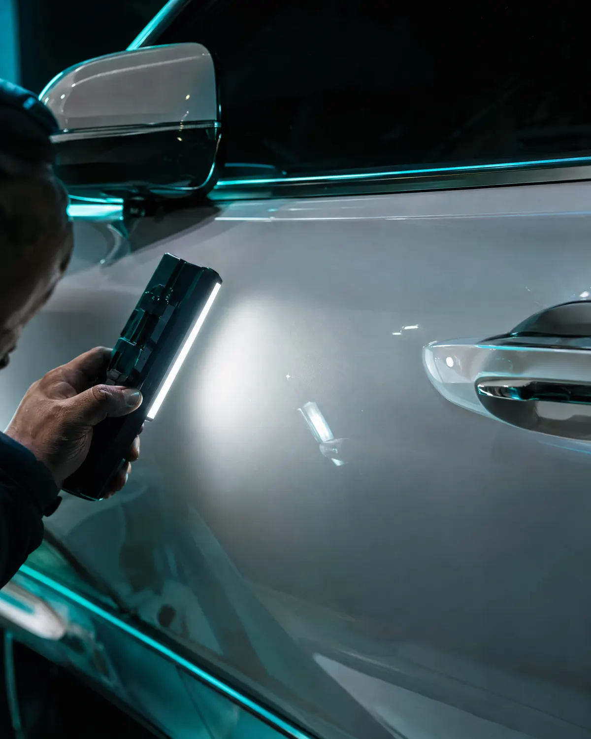 Final paint inspection under a color-match light