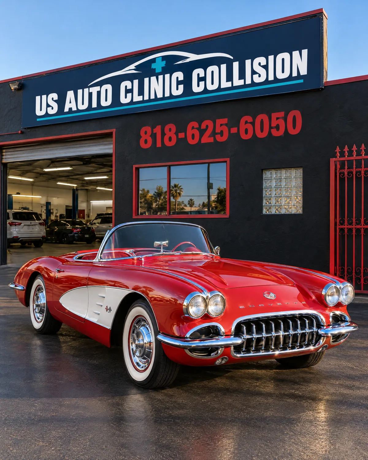 Restored red 1959 Corvette parked outside US Auto Clinic Collision